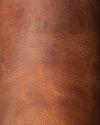 Close-up of brown leather with visible texture and natural grain patterns.