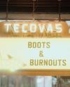 Illuminated sign reads "Tecovas Presents Boots & Burnouts" with a lit arrow pointing left.