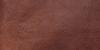Close-up image of dark brown goat leather.