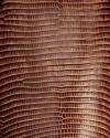 Close-up of textured brown ostrich leather, showing characteristic raised bumps and natural grain pattern.