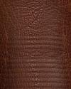 Close-up of brown leather with visible texture and natural grain patterns.