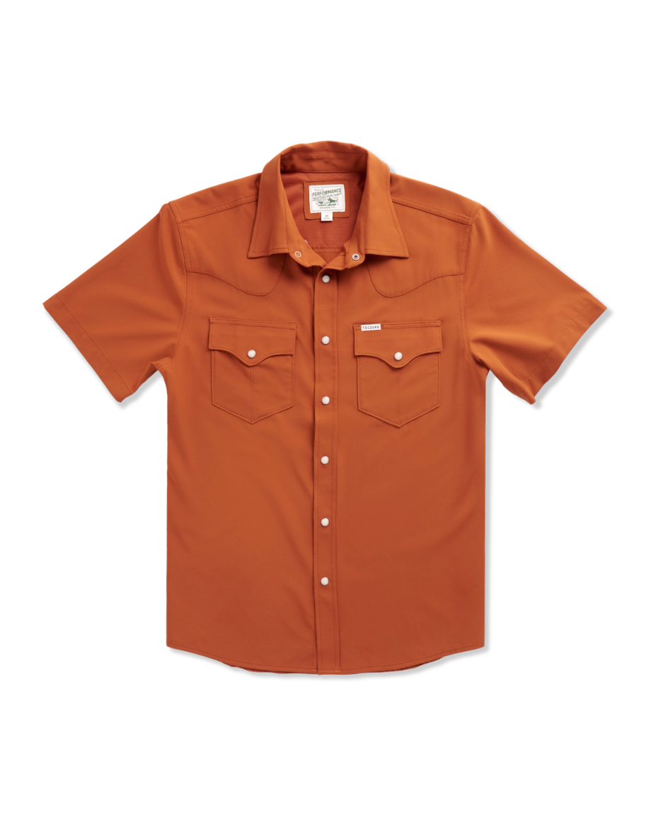 Short-sleeve, button-up orange shirt with two front chest pockets and white snap buttons, laid flat on a white background.