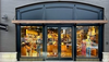 Storefront of Tecovas, featuring large glass doors and windows displaying boots and western wear. The store sign and street number 204 are visible above the entrance.