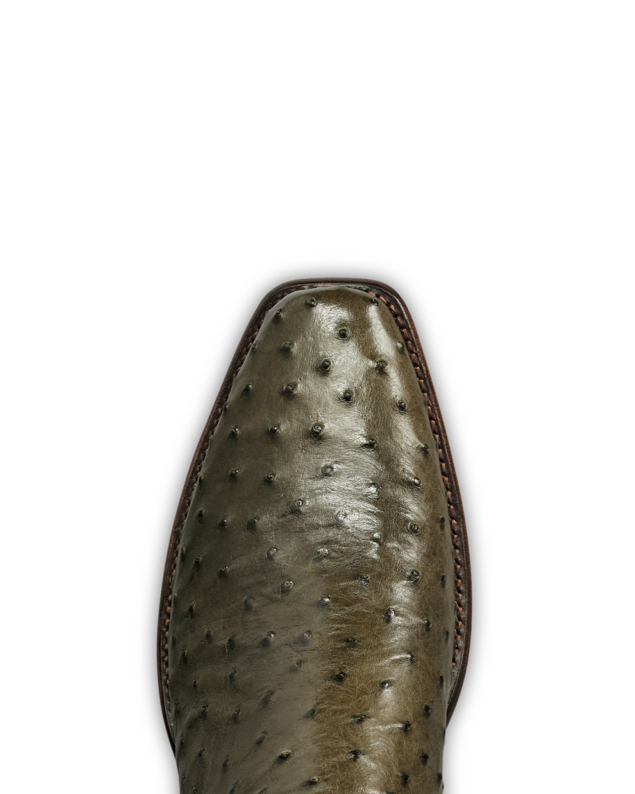 Close-up of the toe of The Jack Ostrich cowboy boot in a distinctive Dark Forest greenish-brown ostrich leather, featuring visible quill bumps and precise stitching along the edge.