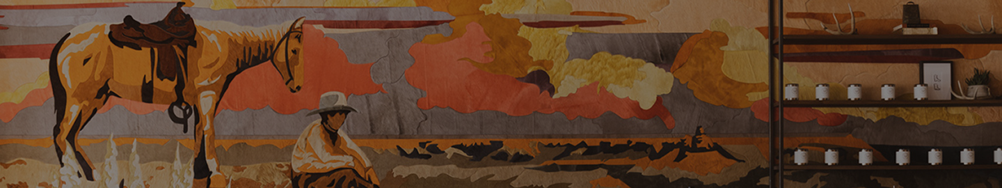 A mural depicting a cowboy sitting near a saddled horse in a desert landscape with shelves of small jars and decor on the right side.