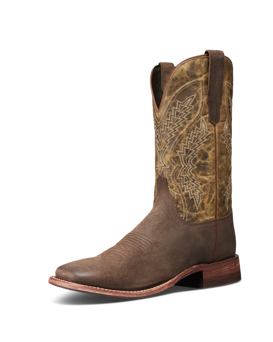 The Doc in Moss Suede. Brown leather cowboy boot with decorative stitching, a round toe, pull straps, and a low wooden heel, featuring elegant moss suede accents, shown on a white background.