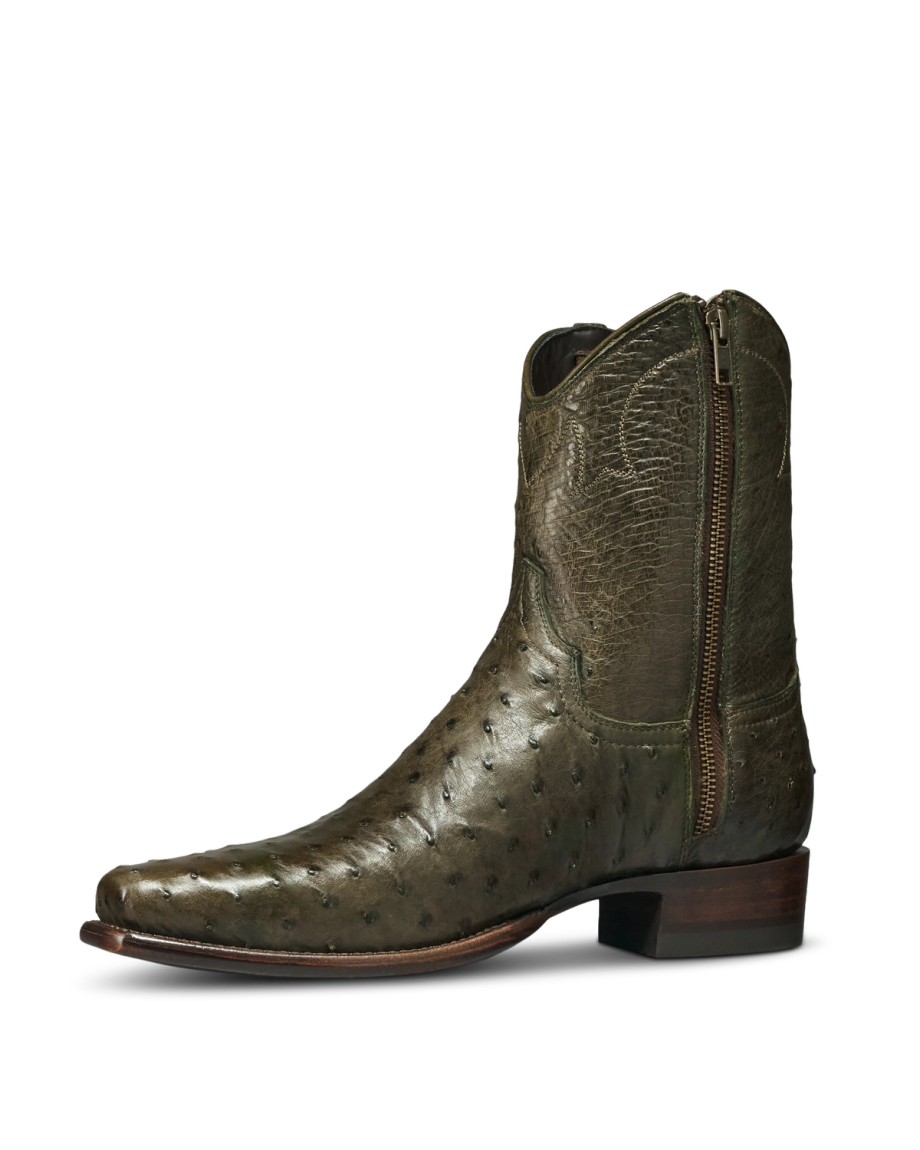 The Jack in Dark Forest Ostrich. Olive green Dark Forest Ostrich leather cowboy boot with a side zipper, low heel, and square toe, shown in a left side profile view against a white background.