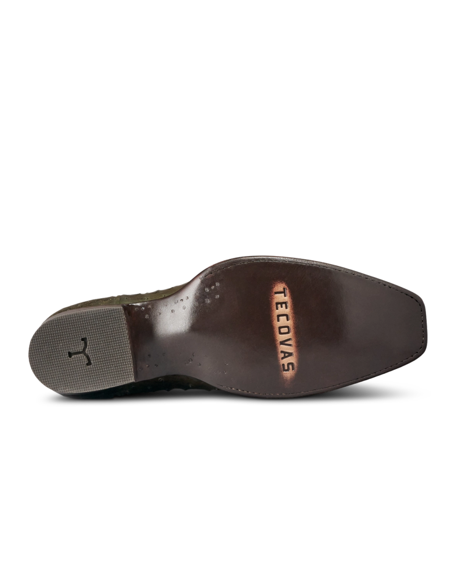 The Jack in Dark Forest Ostrich. The image shows the bottom view of a polished leather cowboy boot sole—crafted from premium Dark Forest Ostrich—with "TECOVIDAS" embossed near the heel and a textured rubber heel cap.
